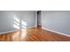 Hardwood floor bedroom with an adjacent hallway at 2041 Grassy Creek Virgilina Rd, Oxford, NC 27565