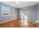 Spacious bedroom featuring hardwood floors and natural light at 2041 Grassy Creek Virgilina Rd, Oxford, NC 27565