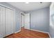 Simple bedroom with double door closet and wood flooring at 2041 Grassy Creek Virgilina Rd, Oxford, NC 27565