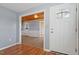 Entryway with hardwood floors and view into the living room at 2041 Grassy Creek Virgilina Rd, Oxford, NC 27565