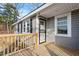 Wooden deck with gray siding and security door at 2041 Grassy Creek Virgilina Rd, Oxford, NC 27565