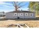 Gray house exterior with a large backyard at 2041 Grassy Creek Virgilina Rd, Oxford, NC 27565