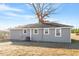 Gray house exterior with a large backyard at 2041 Grassy Creek Virgilina Rd, Oxford, NC 27565