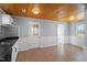Kitchen with white cabinets, tin backsplash, and black appliances at 2041 Grassy Creek Virgilina Rd, Oxford, NC 27565