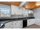 Bright kitchen with white cabinets, stainless steel appliances, and updated countertops at 2041 Grassy Creek Virgilina Rd, Oxford, NC 27565