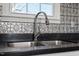 Modern double sink with chrome faucet and stylish backsplash at 2041 Grassy Creek Virgilina Rd, Oxford, NC 27565