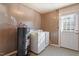 Laundry room with washer, dryer, and water heater at 2041 Grassy Creek Virgilina Rd, Oxford, NC 27565