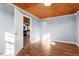 Spacious room with light gray walls and wood flooring at 2041 Grassy Creek Virgilina Rd, Oxford, NC 27565