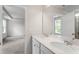 Stylish bathroom with a double sink vanity, quartz countertops, and a large mirror at 211 Grove Township Way, Angier, NC 27501