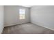 Cozy bedroom with plush carpet and a bright window view at 211 Grove Township Way, Angier, NC 27501