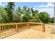 A spacious wooden deck with a view of lush greenery at 211 Grove Township Way, Angier, NC 27501