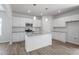 Bright kitchen with white cabinets, granite countertops and stainless appliances at 211 Grove Township Way, Angier, NC 27501
