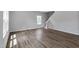 Spacious living area with wood-look flooring and staircase access, perfect for modern living at 211 Grove Township Way, Angier, NC 27501