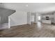Open-concept living area leads to the kitchen, promoting seamless flow and connectivity at 211 Grove Township Way, Angier, NC 27501