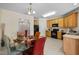 Eat-in kitchen with glass table, wood cabinets, and black appliances at 2118 Stoney Spring Dr, Raleigh, NC 27610