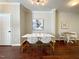 Dining area with white table and chairs, hardwood floor at 2221 Valley Edge Dr # 105, Raleigh, NC 27614