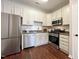 Modern kitchen with white cabinets, stainless steel appliances at 2221 Valley Edge Dr # 105, Raleigh, NC 27614