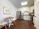 Eat-in kitchen with stainless steel appliances and wood flooring at 2221 Valley Edge Dr # 105, Raleigh, NC 27614