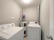 Laundry room with washer, dryer, and water heater at 2221 Valley Edge Dr # 105, Raleigh, NC 27614