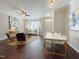 Living area with hardwood floors, white couch, and dining area at 2221 Valley Edge Dr # 105, Raleigh, NC 27614
