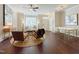 Spacious living room with hardwood floors, a white couch, and a large window at 2221 Valley Edge Dr # 105, Raleigh, NC 27614