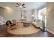 Living room with hardwood floors, a white couch, and a large window at 2221 Valley Edge Dr # 105, Raleigh, NC 27614