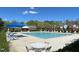 Community pool with lounge chairs and patio tables at 2221 Valley Edge Dr # 105, Raleigh, NC 27614