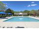 Inviting community pool with plenty of lounge chairs at 2221 Valley Edge Dr # 105, Raleigh, NC 27614