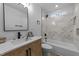 Modern bathroom with a bathtub, shower, and stylish vanity at 2513 Rochelle St, Durham, NC 27703