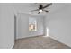 Cozy bedroom with neutral carpeting and a ceiling fan at 2513 Rochelle St, Durham, NC 27703