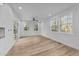 Bright dining area with hardwood floors and large windows at 2513 Rochelle St, Durham, NC 27703
