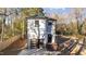 Two-story modern home with gray siding, a dark garage door, and a wooden deck at 2513 Rochelle St, Durham, NC 27703