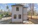 Side view of house showcasing gray siding and landscaping at 2513 Rochelle St, Durham, NC 27703
