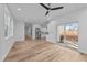 Spacious living room featuring hardwood floors and sliding glass doors at 2513 Rochelle St, Durham, NC 27703