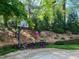 Backyard area with a basketball hoop and stack of firewood at 2900 Glenanneve Pl, Raleigh, NC 27608
