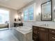 Elegant bathroom with dual vanities, soaking tub, and separate shower at 2900 Glenanneve Pl, Raleigh, NC 27608