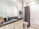 Bathroom with a bathtub and dark countertop at 2900 Glenanneve Pl, Raleigh, NC 27608