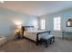 Serene bedroom with a queen-size bed and light blue walls at 2900 Glenanneve Pl, Raleigh, NC 27608