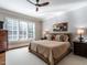 Comfortable bedroom featuring large windows with plantation shutters and neutral decor at 2900 Glenanneve Pl, Raleigh, NC 27608