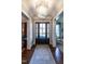 Grand foyer featuring a beautiful chandelier, hardwood floors, and a decorative rug at 2900 Glenanneve Pl, Raleigh, NC 27608