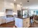 Elegant kitchen featuring a stainless steel range, a custom range hood, and lots of counter space at 2900 Glenanneve Pl, Raleigh, NC 27608