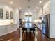 Gourmet kitchen boasts white cabinets, stainless appliances, and a large center island at 2900 Glenanneve Pl, Raleigh, NC 27608