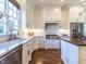 Bright kitchen boasting updated appliances, white subway tile backsplash, and pristine counters at 2900 Glenanneve Pl, Raleigh, NC 27608