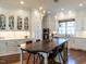 Beautiful kitchen featuring custom cabinetry, pendant lighting, and an oversized island with seating at 2900 Glenanneve Pl, Raleigh, NC 27608