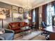 Cozy living room featuring a comfortable seating arrangement, unique decor, and natural light at 2900 Glenanneve Pl, Raleigh, NC 27608