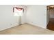 Cozy carpeted bedroom with neutral walls and a window allowing in natural light at 301 King Arthur Trl, Garner, NC 27529