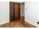 Bedroom with hardwood floors and double door closet at 301 King Arthur Trl, Garner, NC 27529