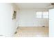 View of kitchen area with tile floor and white cabinets at 301 King Arthur Trl, Garner, NC 27529