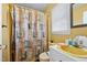 Clean bathroom with single vanity, toilet and shower/tub combo at 307 E Jackson St, Mebane, NC 27302