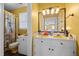 Bathroom with double vanity, shower, and updated fixtures at 307 E Jackson St, Mebane, NC 27302
